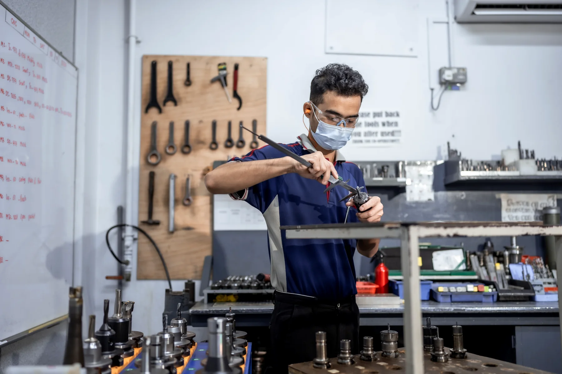 A Yong Heng toolmaker at the fitting bench.