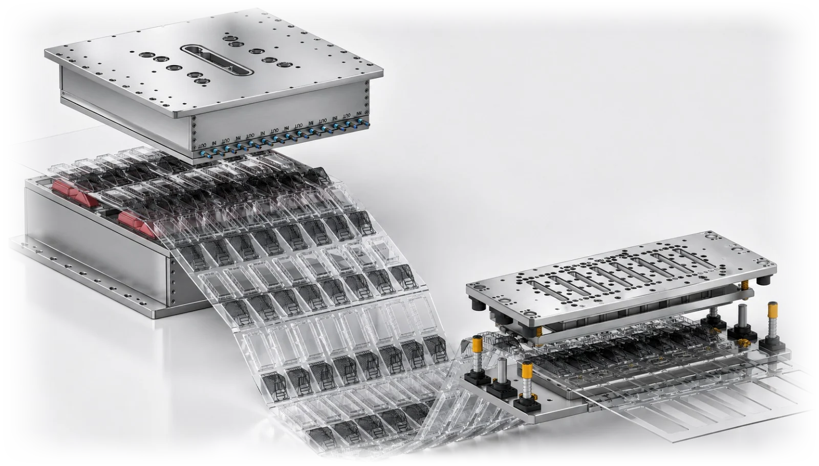 A Yong Heng thermoforming mold with the run of formed clear containers it produced, beside its punching tool.
