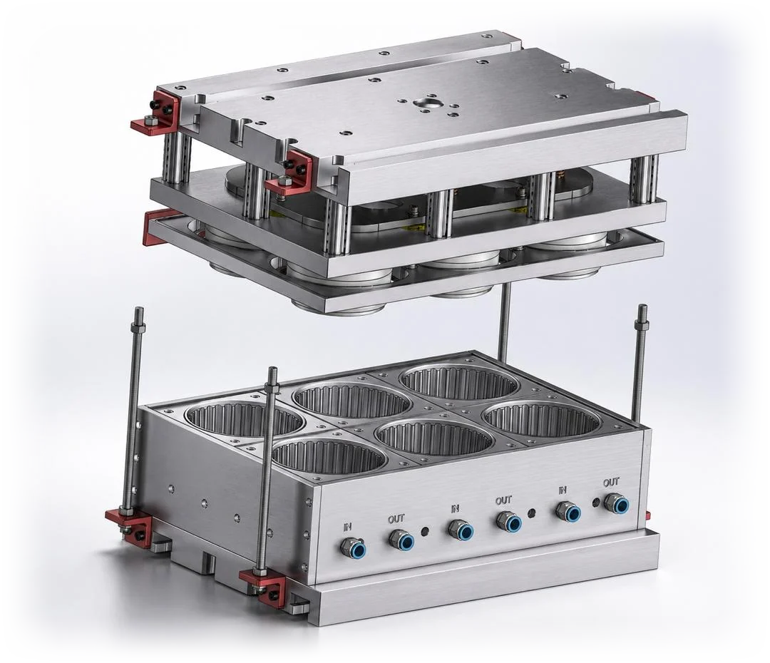 A Yong Heng pressure box with its inlet and outlet cooling ports.