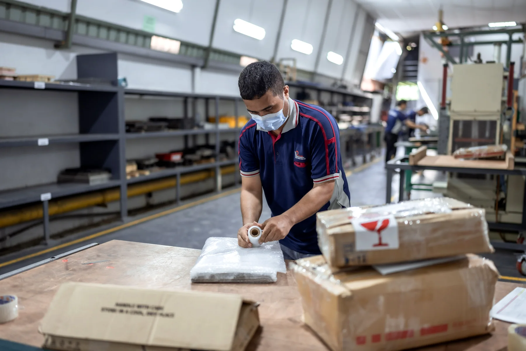 A Yong Heng team member packing a finished tool for despatch.